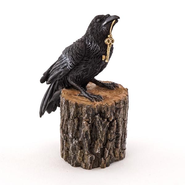 Raven with Key on Tree Stump